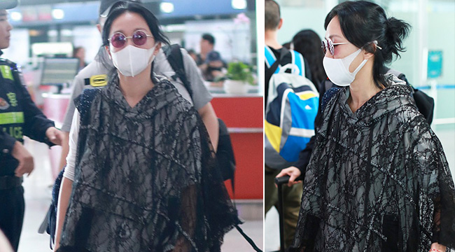 周迅蕾丝帽衫现身机场气质佳 围堵路人少