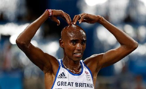 8月13日,英国选手法拉赫在比赛后庆祝.